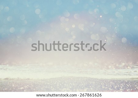 background of blurred beach and sea waves with bokeh lights, vintage filter.