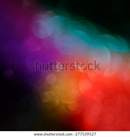 abstract blurred photo of bokeh light burst and textures. multicolored light.