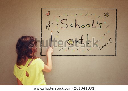 back view of cute kid next to textured background with the phrase school\'s out
