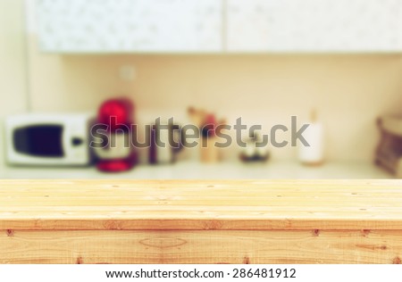 empty table board and defocused white retro kitchen background