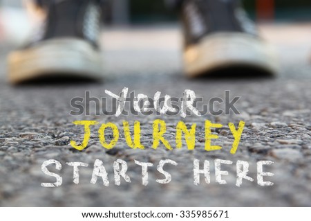 image with selective focus over asphalt road and person with handwritten text - your journey starts here.  education and motivation concept
