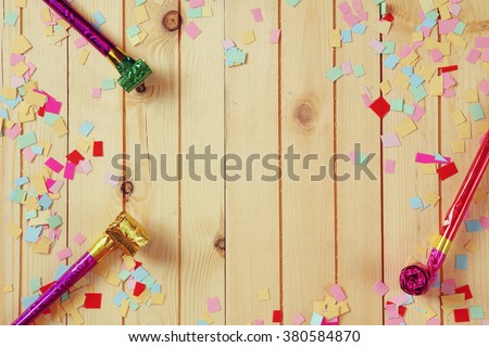 party background with colorful confetti and party whistle