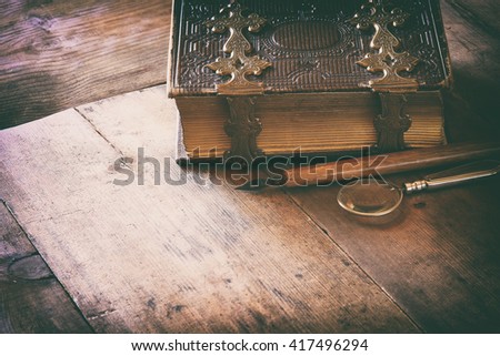 top view of antique book cover, with brass clasps. vintage filtered and toned