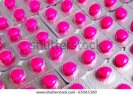 pink medicine pills pack pile closeup as a background picture