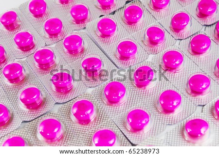 pink medicine pills pack pile closeup as a background picture