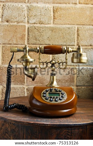vintage luxurious telephone old fashion on brick wall background