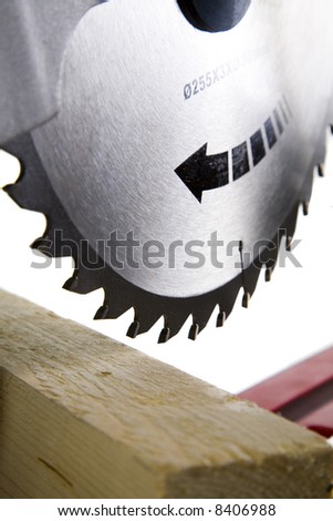 Timber Ready to bo Cut with Mitre Saw, Blade in Focus