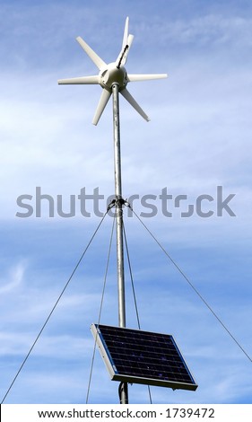 Solar power environment friendly wind mill turbine, over a blue sky background.