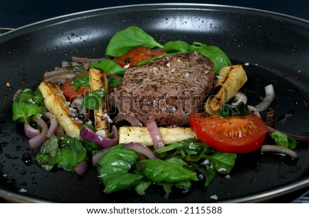 Summer lunch with spring vegetables, cherry tomato & steak, macro closeup