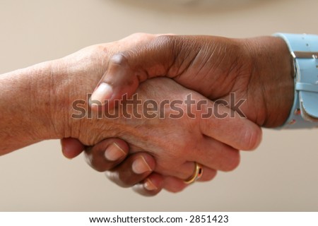 Helping hand shakes another hand as part of an agreement