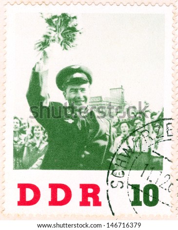 GERMANY - CIRCA 1963: An old used German Democratic Republic postage stamp issued in honor of the visit to GDR second human to orbit the Earth, Soviet cosmonaut Gherman Titov; series, circa 1963