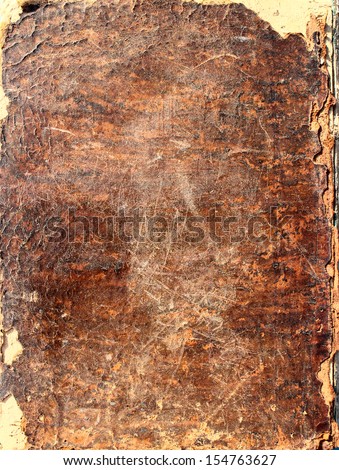 Fragment of an ancient leather handmade book cover as backgrounds