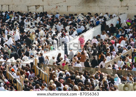 JERUSALEM, ISRAEL - APRIL 5: A group of orthodox religious men and women wear prayer shawls and pray during the Jewish Pesach (Passover) celebration on April 5, 2007 at the Wailing Wall in Jerusalem, Israel.