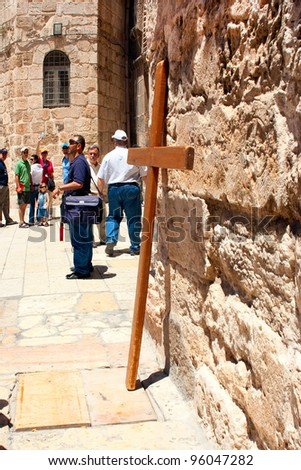 JERUSALEM - JUNE 30: Group of tourists gather near the entrance of the Church of The Holy Sepulcher on June 30, 2007 in Jerusalem.  Inside the Church is the tomb of Christ.
