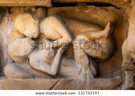 KHAJURAHO, INDIA - APRIL 17: Stone carved erotic sculptures in Hindu temple on April 17, 2012 in Khajuraho, India. Unesco World Heritage.