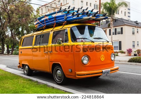 LOS ANGELES, CALIFORNIA, USA - OCT 21: Volkswagen transporter with surf boards parked on the street, Los Angeles, CA, USA on oct 21, 2013. Famous van was manufactured for about 64 years in 1949-2013.