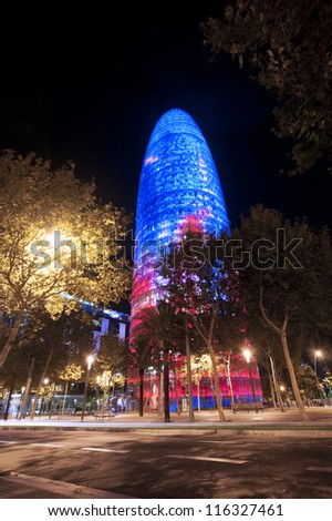 BARCELONA, SPAIN - SEPTEMBER 26: Torre Agbar illuminated at night on September 26, 2012 in Barcelona, Spain. This 38-store tower was designed by the famous architect Jean Nouvel