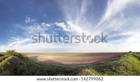 Field panorama and beautiful sky in rural area of Eastern Europe