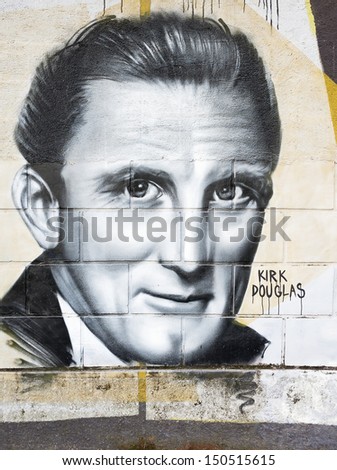 OPATIJA CROATIA - CIRCA JULY 2013: Kirk Douglas graffiti in Angiolina park, Opatija circa July 2013. Faces on this wall represent famous people who visited this Croatian touristic city.