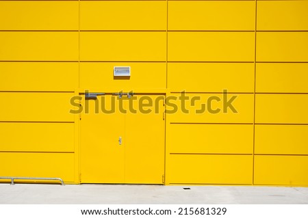Yellow Door Industrial Storage Building made of Metal Panels