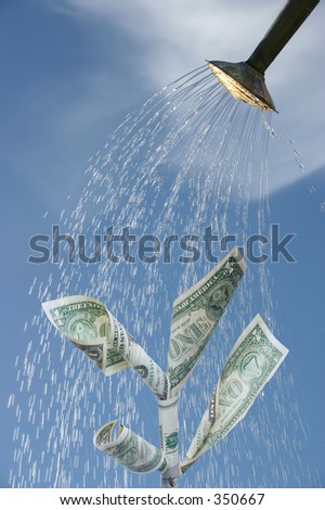 Dollar notes in a tree shape being watered to produce growth.