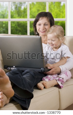CLIPPING PATH! Mother with daughter on the sofa