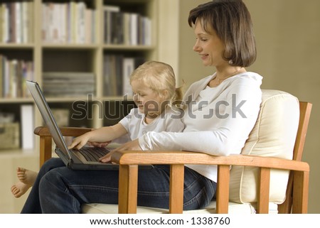 CLIPPING PATH! Mother with daughter with laptop