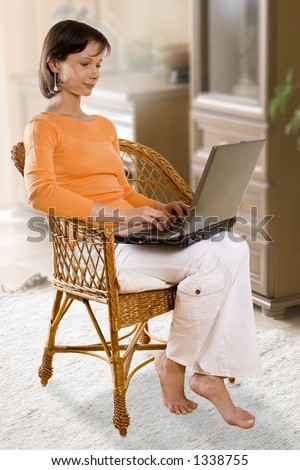 CLIPPING PATH! Woman with laptop on the chair