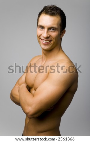 stock photo Portrait of young and muscular man with nacked tanned body