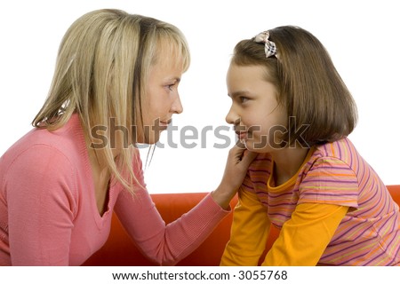stock photo Mother and her 1012yo daughter are looking their eyes Side