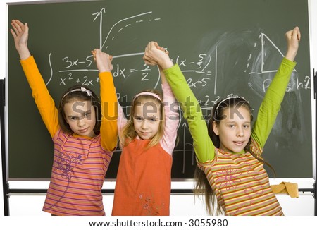 Group of girls (5, 11 and 13yo) are standing and looking at camera