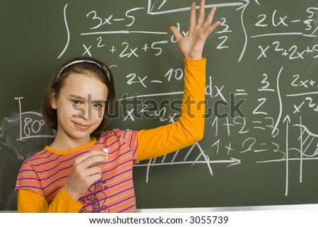 stock photo 11yo girl are standing with chalk in hand