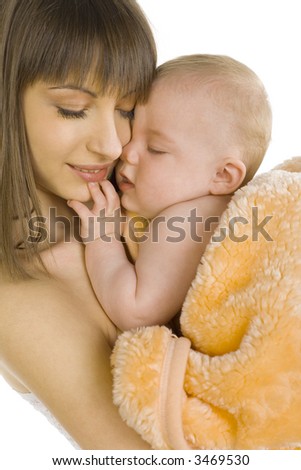 stock photo Young naked mother holding and hugging baby boy in towel