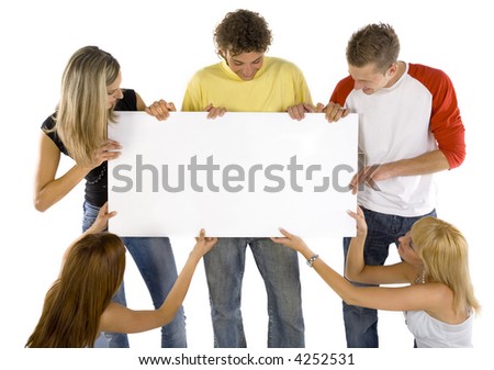 stock photo Small group of teenagers holding white blank board