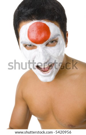 Young screaming and naked Japanese sport\'s fan with painted flag on face. Front view. Looking at camera, white background
