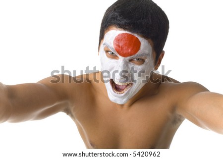 Young screaming and naked Japanese sport\'s fan with painted flag on face. High angle view. Looking at camera, white background