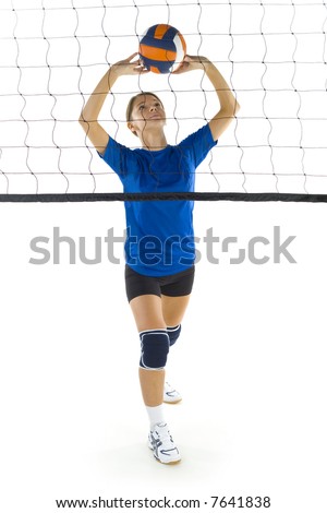 Young, beauty volleyball player. Standing in front of net with ball. White background. Whole body, front view