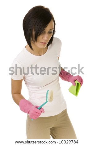Young woman standing and holding in hands washcloth and scrubbing brush. Front view, white background.