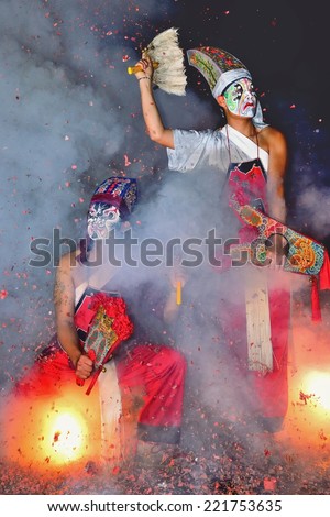 Chiayi, TAIWAN - April 4 : Traditional festivals of Earth God ,  the underworld police to ward off evil spirits and show their prowess in the violent firecrackers on April 4, 2014 in Chiayi, Taiwan