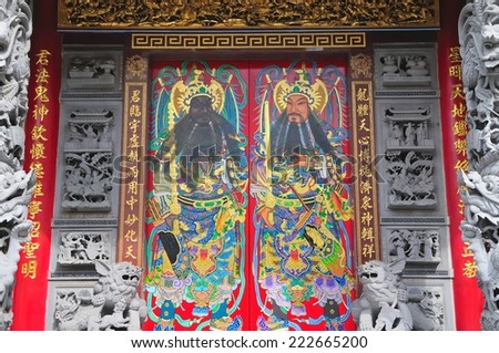 Taiwan traditional painted temple door God and the dragon pillar stone