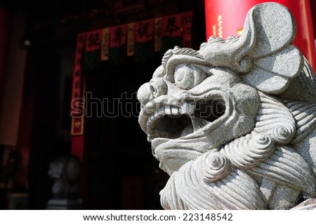 Chinese stone lions in front of the temple, majestic guard throughout the Holy Land