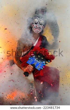 Chiayi, TAIWAN Apr. 14th : In Zunwang temple, Eight Generals sat in the firecracker at the junction fire, to expel the evil spirit pray for peace ceremony on Apr. 14th ,2014 in Chiayi, TAIWAN