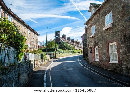 Village road PetWorth West Sussex UK. Showing rows of houses.