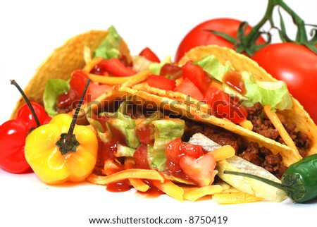 Closeup of tacos with tomatoes, habanero and serrano peppers.  Isolated on white background.