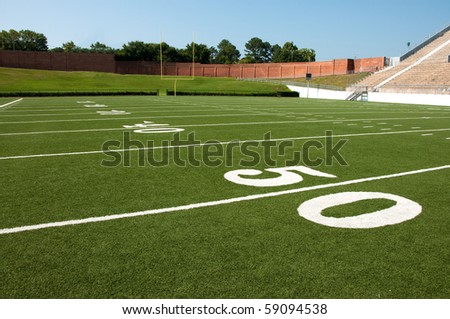 stock photo : American football field with goal post in background.