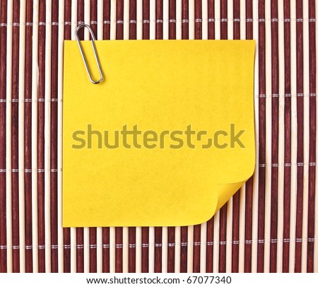 Yellow note on mat