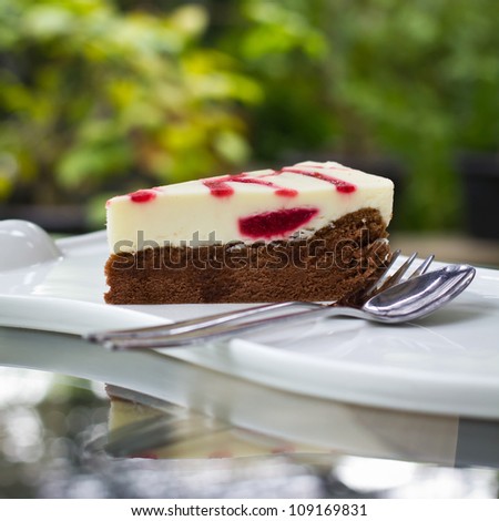 Strawberry cheese cake on glass table