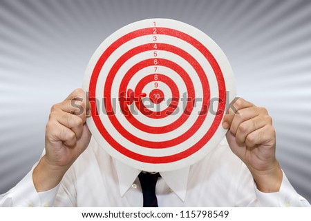 Businessman show the dart and target accuracy