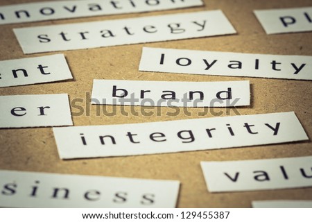 Brand on cut paper with others business keyword