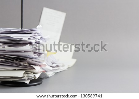 Pile of receipts in paper nail